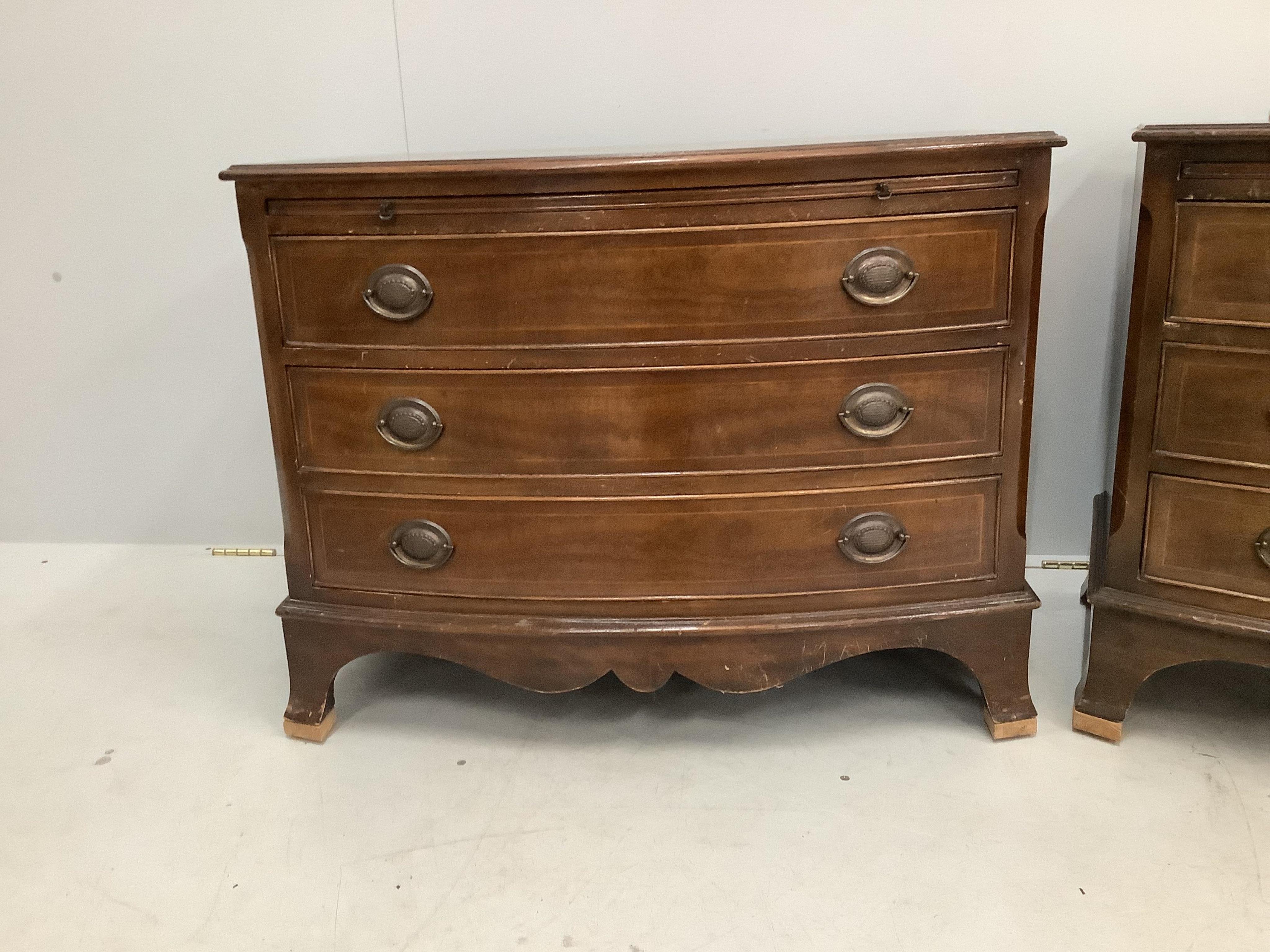 A pair of reproduction inlaid mahogany bow front chests of three long drawers, width 87cm, depth 49cm, height 68cm. Condition - poor to fair